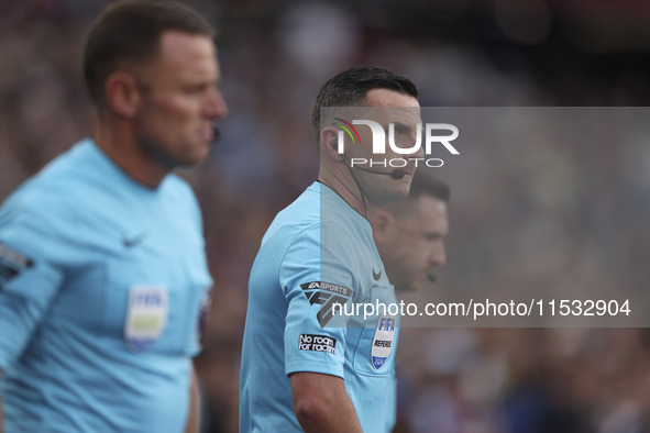 Match referee Michael Oliver during the Premier League match between West Ham United and Manchester City at the London Stadium in Stratford,...