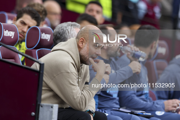 Pep Guardiola of Manchester City during the Premier League match between West Ham United and Manchester City at the London Stadium in Stratf...