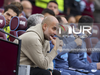 Pep Guardiola of Manchester City during the Premier League match between West Ham United and Manchester City at the London Stadium in Stratf...