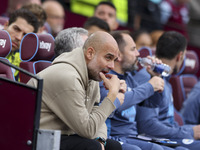 Pep Guardiola of Manchester City during the Premier League match between West Ham United and Manchester City at the London Stadium in Stratf...