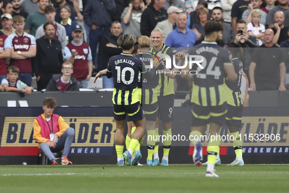 Erling Haaland of Manchester City celebrates his first goal during the Premier League match between West Ham United and Manchester City at t...