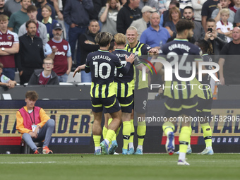 Erling Haaland of Manchester City celebrates his first goal during the Premier League match between West Ham United and Manchester City at t...