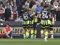 Erling Haaland of Manchester City celebrates his first goal during the Premier League match between West Ham United and Manchester City at t...