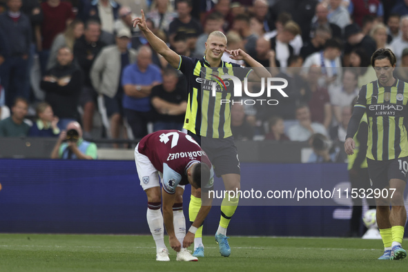 Erling Haaland of Manchester City celebrates his second goal during the Premier League match between West Ham United and Manchester City at...