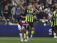 Erling Haaland of Manchester City celebrates his second goal during the Premier League match between West Ham United and Manchester City at...