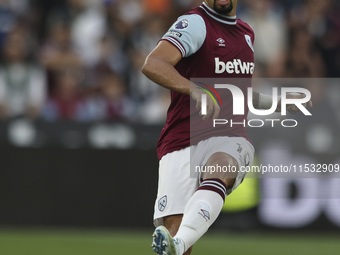 Lucas Paqueta of West Ham United passes the ball during the Premier League match between West Ham United and Manchester City at the London S...