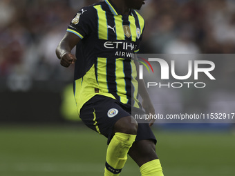 Jeremy Doku of Manchester City on the ball during the Premier League match between West Ham United and Manchester City at the London Stadium...