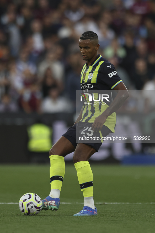 Manuel Akanji of Manchester City is on the ball during the Premier League match between West Ham United and Manchester City at the London St...