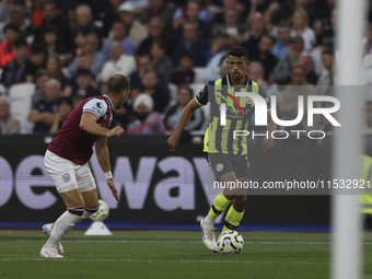 Matheus Nunes of Manchester City on the ball during the Premier League match between West Ham United and Manchester City at the London Stadi...