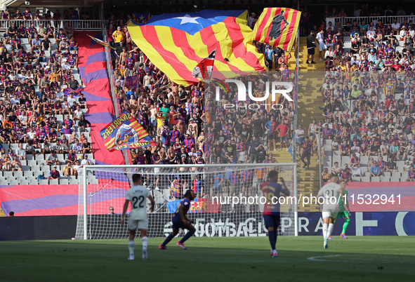 FC Barcelona supporters wave the Catalan independence flag during the match between FC Barcelona and Real Valladolid CF, corresponding to we...