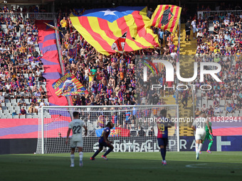 FC Barcelona supporters wave the Catalan independence flag during the match between FC Barcelona and Real Valladolid CF, corresponding to we...