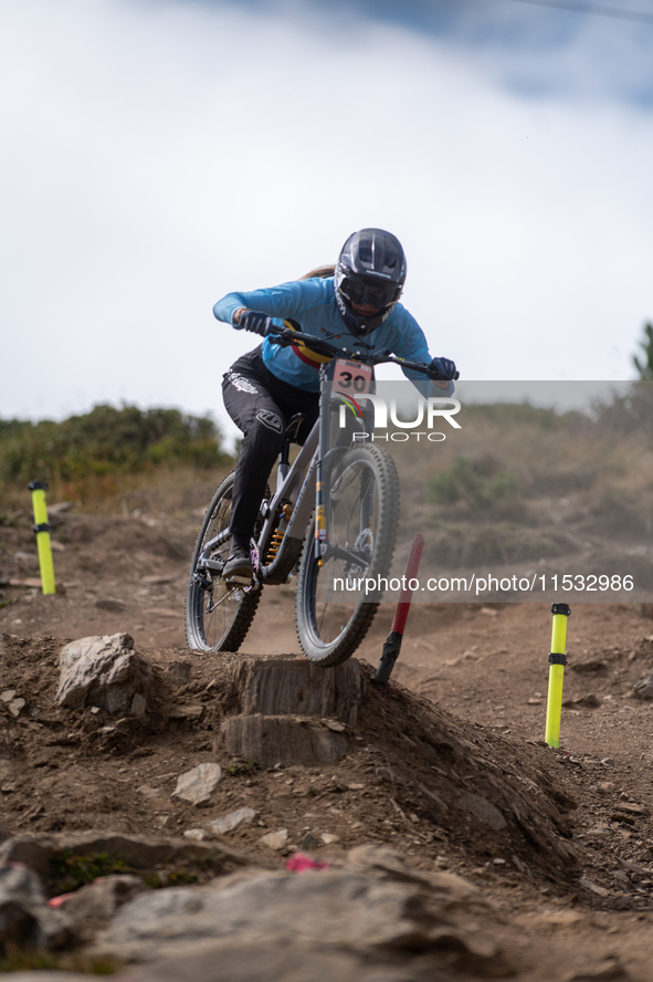 Luke Meier-Smith of Australia participates in the UCI Mountain Bike World Championships Men Downhill Race in Pal Arinsal, Andorra, on August...