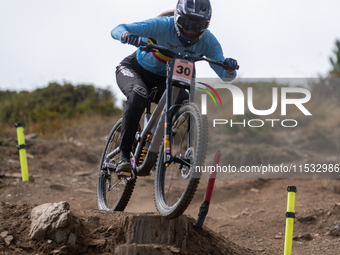 Luke Meier-Smith of Australia participates in the UCI Mountain Bike World Championships Men Downhill Race in Pal Arinsal, Andorra, on August...