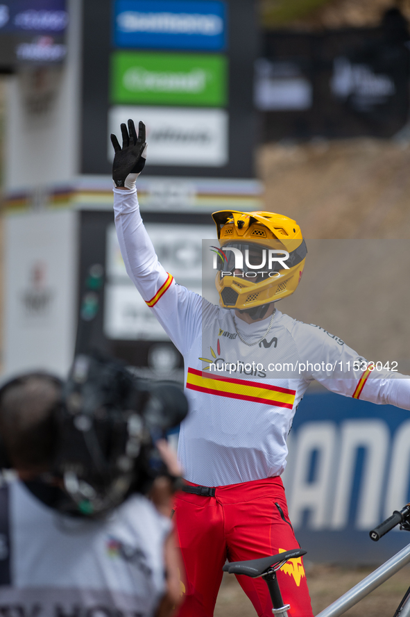 Angel Suarez of Spain arrives at the finish line in the UCI Mountain Bike World Championships Men Downhill in Pal Arinsal, Andorra, on Augus...