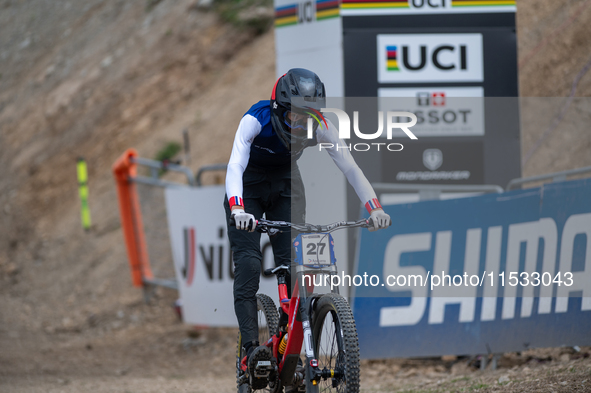 Nathan Pontvianne of France arrives at the finish line in the UCI Mountain Bike World Championships Men Downhill in Pal Arinsal, Andorra, on...