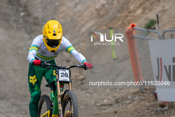 Oliver Davis of Australia arrives at the finish line in the UCI Mountain Bike World Championships Men Downhill in Pal Arinsal, Andorra, on A...