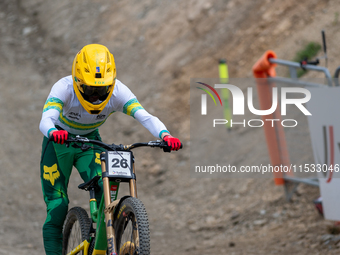 Oliver Davis of Australia arrives at the finish line in the UCI Mountain Bike World Championships Men Downhill in Pal Arinsal, Andorra, on A...