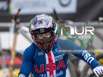 Dylan Maples of the USA arrives at the finish line in the UCI Mountain Bike World Championships Men Downhill in Pal Arinsal, Andorra, on Aug...