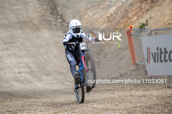 Lachlan Stevens-Mcnab of New Zealand arrives at the finish line in the UCI Mountain Bike World Championships Men Downhill in Pal Arinsal, An...