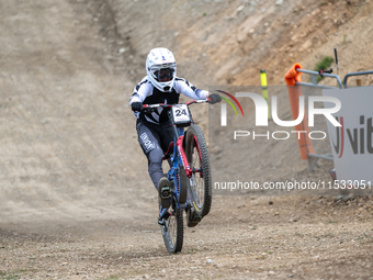 Lachlan Stevens-Mcnab of New Zealand arrives at the finish line in the UCI Mountain Bike World Championships Men Downhill in Pal Arinsal, An...