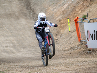 Lachlan Stevens-Mcnab of New Zealand arrives at the finish line in the UCI Mountain Bike World Championships Men Downhill in Pal Arinsal, An...