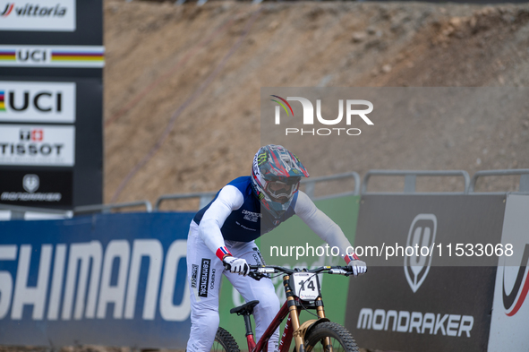 Thibaut Daprela of France arrives at the finish line in the UCI Mountain Bike World Championships Men Downhill in Pal Arinsal, Andorra, on A...