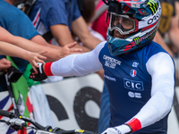 Thibaut Daprela of France arrives at the finish line in the UCI Mountain Bike World Championships Men Downhill in Pal Arinsal, Andorra, on A...