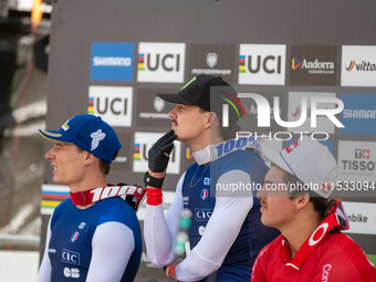 Riders await the definition of the race in the UCI Mountain Bike World Championships Men Downhill in Pal Arinsal, Andorra, on August 31, 202...