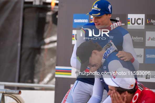 Riders await the definition of the race in the UCI Mountain Bike World Championships Men Downhill in Pal Arinsal, Andorra, on August 31, 202...