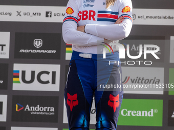 Tahnee Seagrave of Great Britain stands on the podium at the UCI Mountain Bike World Championships Women Downhill in Pal Arinsal, Andorra, o...