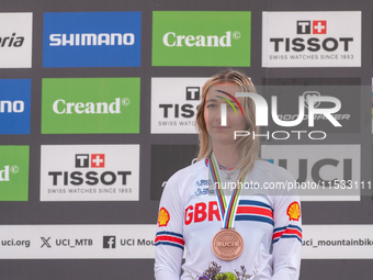 Tahnee Seagrave of Great Britain stands on the podium at the UCI Mountain Bike World Championships Women Downhill in Pal Arinsal, Andorra, o...