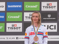 Tahnee Seagrave of Great Britain stands on the podium at the UCI Mountain Bike World Championships Women Downhill in Pal Arinsal, Andorra, o...