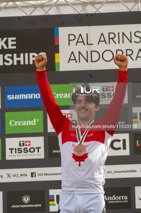 Finn Iles of Canada stands on the podium at the UCI Mountain Bike World Championships Women Downhill in Pal Arinsal, Andorra, on August 31,...