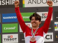 Finn Iles of Canada stands on the podium at the UCI Mountain Bike World Championships Women Downhill in Pal Arinsal, Andorra, on August 31,...