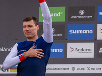 Benoit Coulanges of France stands on the podium at the UCI Mountain Bike World Championships Women Downhill in Pal Arinsal, Andorra, on Augu...