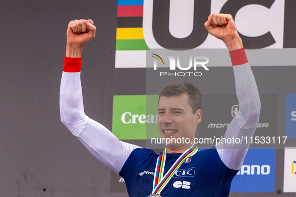 Benoit Coulanges of France stands on the podium at the UCI Mountain Bike World Championships Women Downhill in Pal Arinsal, Andorra, on Augu...