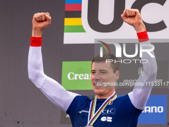 Benoit Coulanges of France stands on the podium at the UCI Mountain Bike World Championships Women Downhill in Pal Arinsal, Andorra, on Augu...