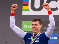 Benoit Coulanges of France stands on the podium at the UCI Mountain Bike World Championships Women Downhill in Pal Arinsal, Andorra, on Augu...