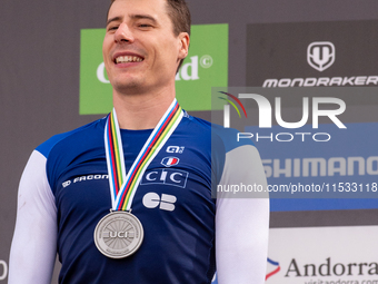 Benoit Coulanges of France stands on the podium at the UCI Mountain Bike World Championships Women Downhill in Pal Arinsal, Andorra, on Augu...