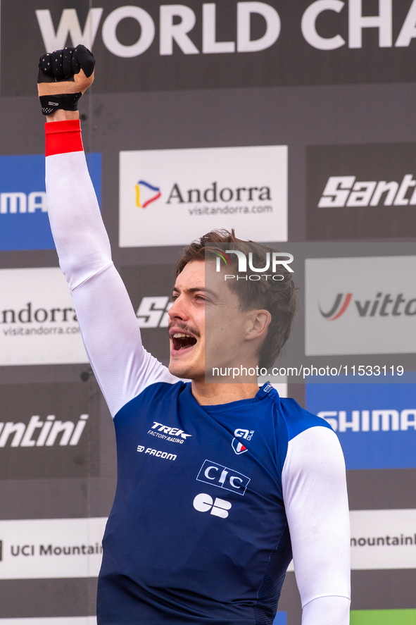 Benoit Coulanges of France stands on the podium at the UCI Mountain Bike World Championships Women Downhill in Pal Arinsal, Andorra, on Augu...