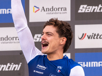 Benoit Coulanges of France stands on the podium at the UCI Mountain Bike World Championships Women Downhill in Pal Arinsal, Andorra, on Augu...