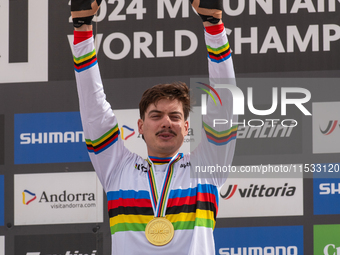 Loris Vergier of France stands on the podium at the UCI Mountain Bike World Championships Women Downhill in Pal Arinsal, Andorra, on August...