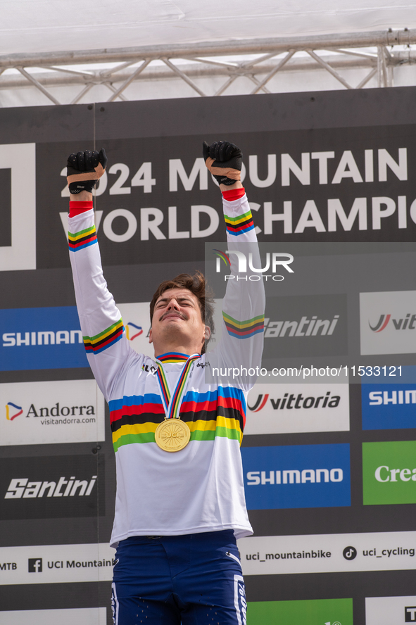 Loris Vergier of France stands on the podium at the UCI Mountain Bike World Championships Women Downhill in Pal Arinsal, Andorra, on August...