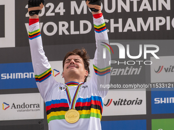 Loris Vergier of France stands on the podium at the UCI Mountain Bike World Championships Women Downhill in Pal Arinsal, Andorra, on August...