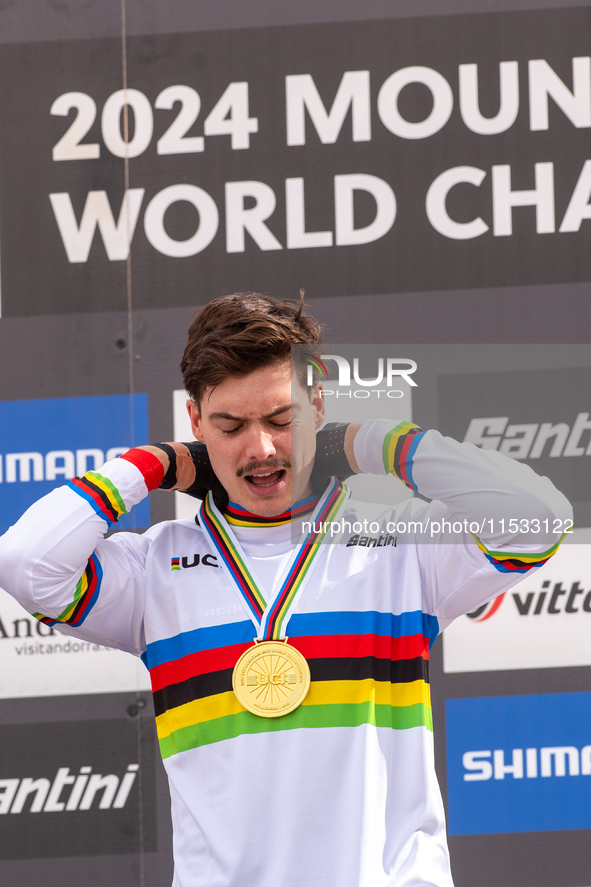 Loris Vergier of France stands on the podium at the UCI Mountain Bike World Championships Women Downhill in Pal Arinsal, Andorra, on August...