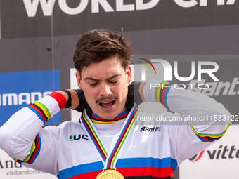 Loris Vergier of France stands on the podium at the UCI Mountain Bike World Championships Women Downhill in Pal Arinsal, Andorra, on August...