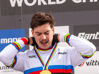 Loris Vergier of France stands on the podium at the UCI Mountain Bike World Championships Women Downhill in Pal Arinsal, Andorra, on August...