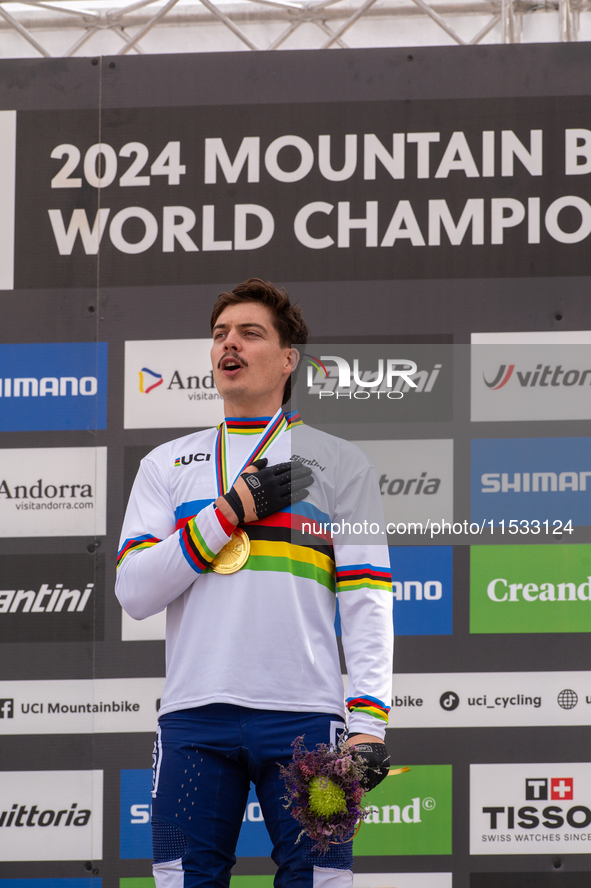 Loris Vergier of France stands on the podium at the UCI Mountain Bike World Championships Women Downhill in Pal Arinsal, Andorra, on August...