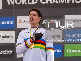 Loris Vergier of France stands on the podium at the UCI Mountain Bike World Championships Women Downhill in Pal Arinsal, Andorra, on August...