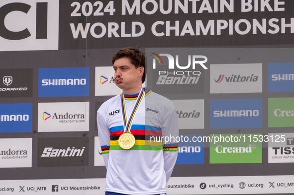 Loris Vergier of France stands on the podium at the UCI Mountain Bike World Championships Women Downhill in Pal Arinsal, Andorra, on August...